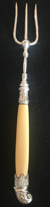 Antique silver bread fork with ornate detail