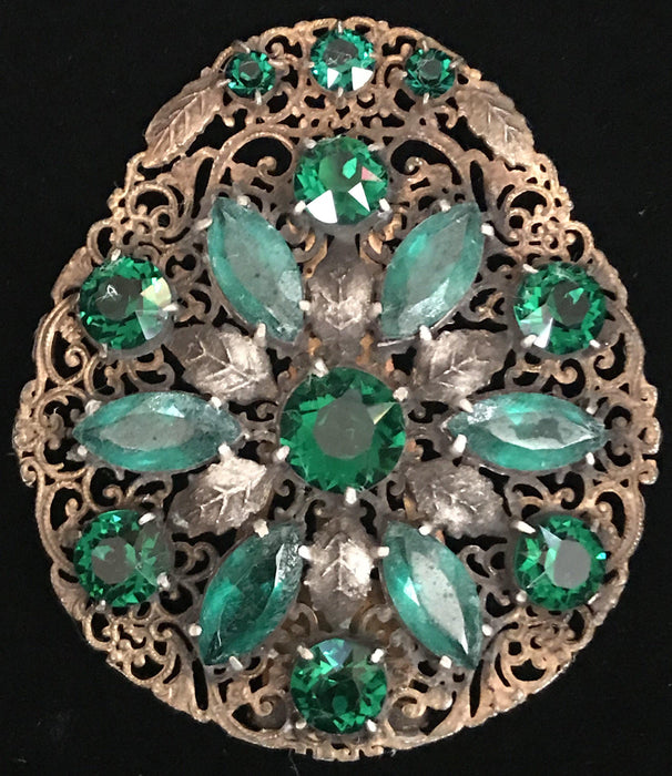 Antique dress clip with green emerald style stones 
