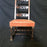 Antique carved walnut chair with orange upholstered seat 