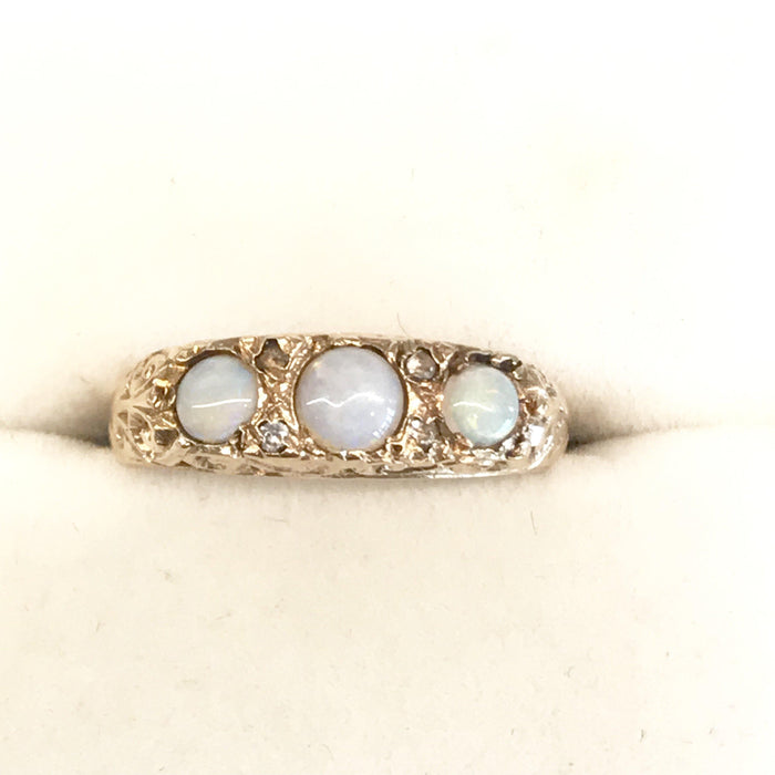 Vintage gold engagement ring with opals and diamonds