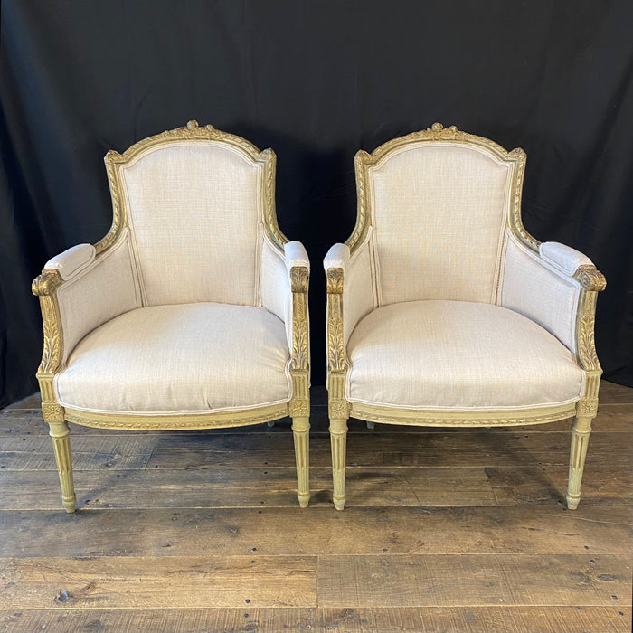 Pair of Intricately Carved French 19th Century Painted Louis XVI Bergere Armchairs with New Neutral Upholstery