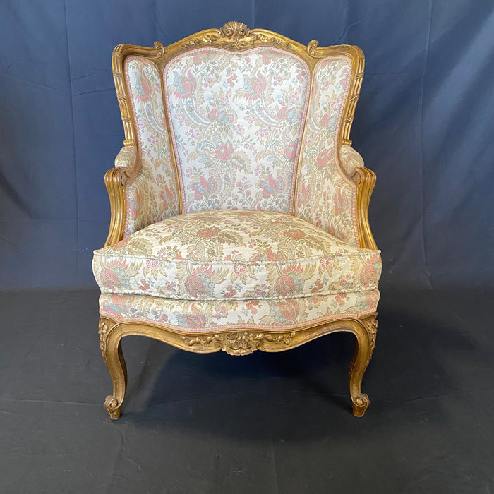 Pair of French Louis XV Giltwood Bergere Armchairs or Wingback Chairs with Carved Floral Motifs