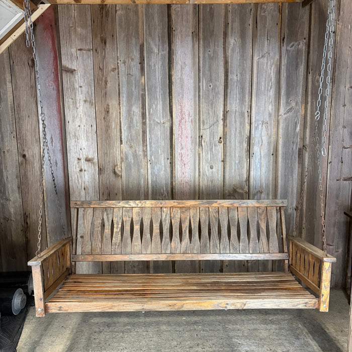 Antique Maine Wooden Porch Swing with Slatted Seat and Decorative Cutout Back