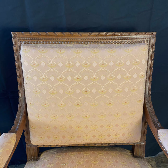Pair of French Louis XVI Hand Carved Walnut Armchairs or Fauteuils Late 19th/Early 20th Century