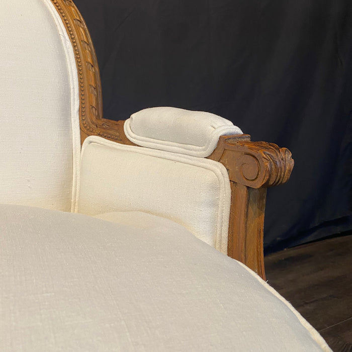 Pair of French Louis XVI Carved Walnut Armchairs or Bergere Chairs