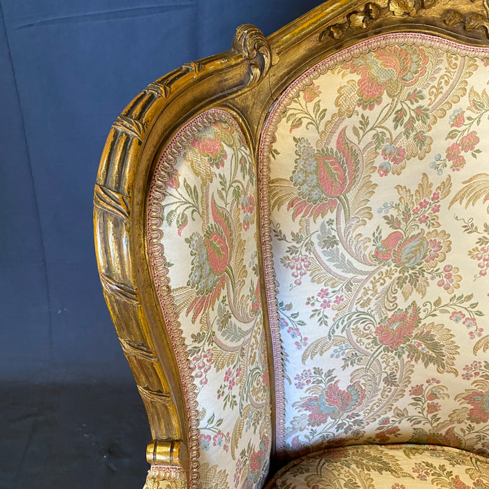 Pair of French Louis XV Giltwood Bergere Armchairs or Wingback Chairs with Carved Floral Motifs