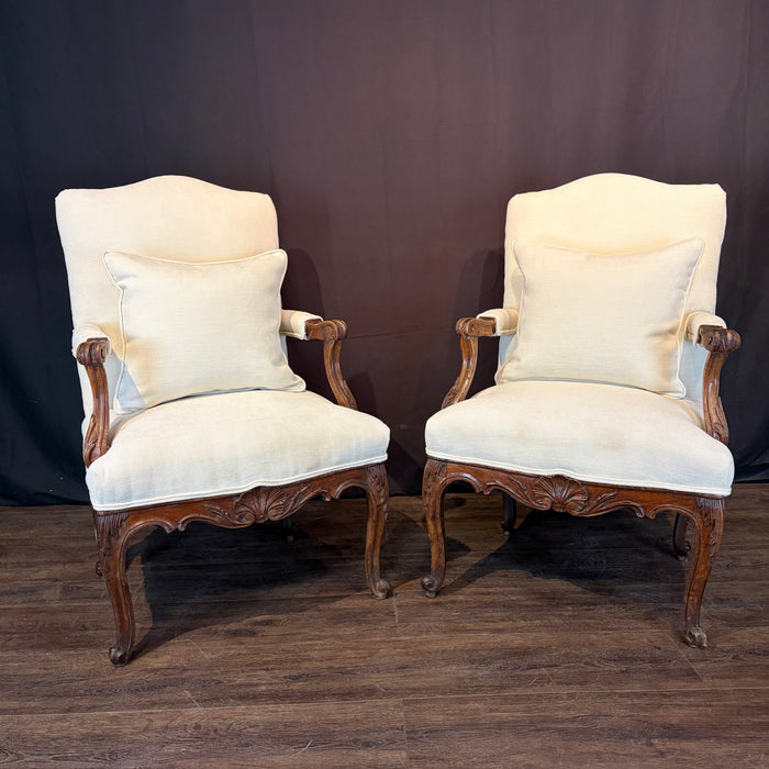 Pair of Early 19th Century French Louis XV Carved Walnut Fauteuil Armchairs with New Neutral Upholstery