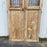 Pair of 19th Century French Paneled Doors with Intricate Wrought Iron Panels