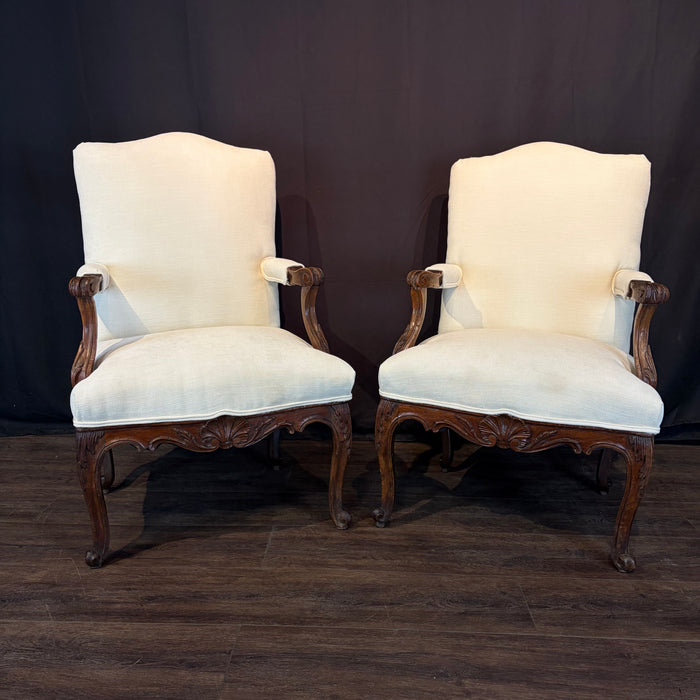Pair of Early 19th Century French Louis XV Carved Walnut Fauteuil Armchairs with New Neutral Upholstery
