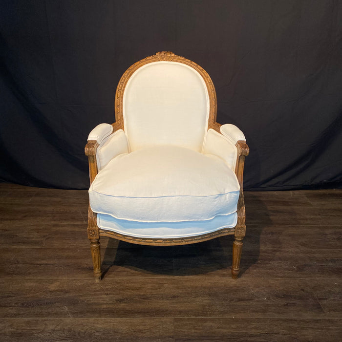Pair of French Louis XVI Carved Walnut Armchairs or Bergere Chairs