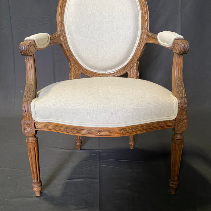 Classic French Pair of Antique Highly Carved Louis XVI Armchairs or Fauteuils Newly Reupholstered