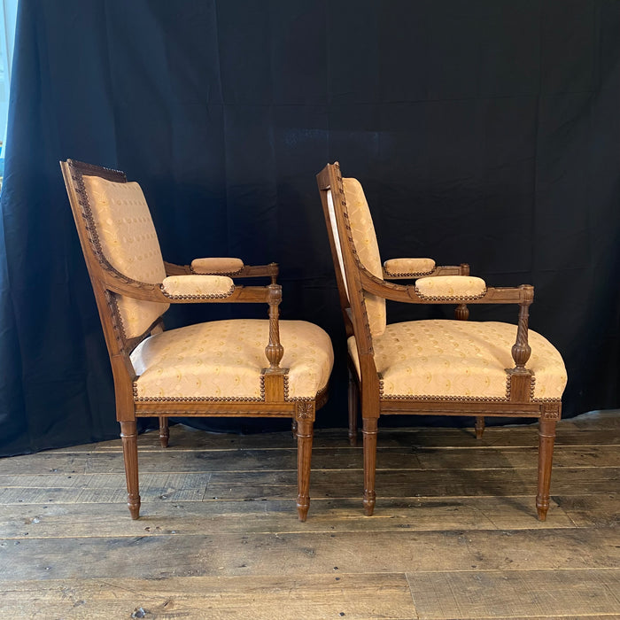 Pair of French Louis XVI Hand Carved Walnut Armchairs or Fauteuils Late 19th/Early 20th Century
