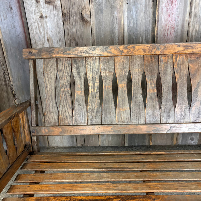 Antique Maine Wooden Porch Swing with Slatted Seat and Decorative Cutout Back