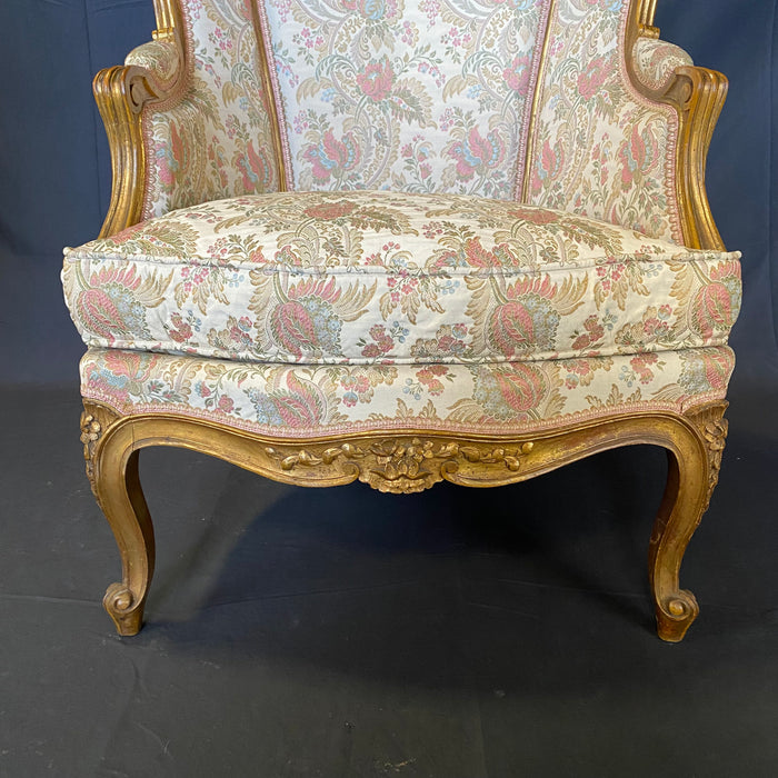 Pair of French Louis XV Giltwood Bergere Armchairs or Wingback Chairs with Carved Floral Motifs