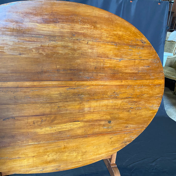 Large Oval French Early 19th Century Vigneron or Tilt-Top Walnut 'Table De Vendange' or Wine Tasting Table with Lovely Cherry Patina