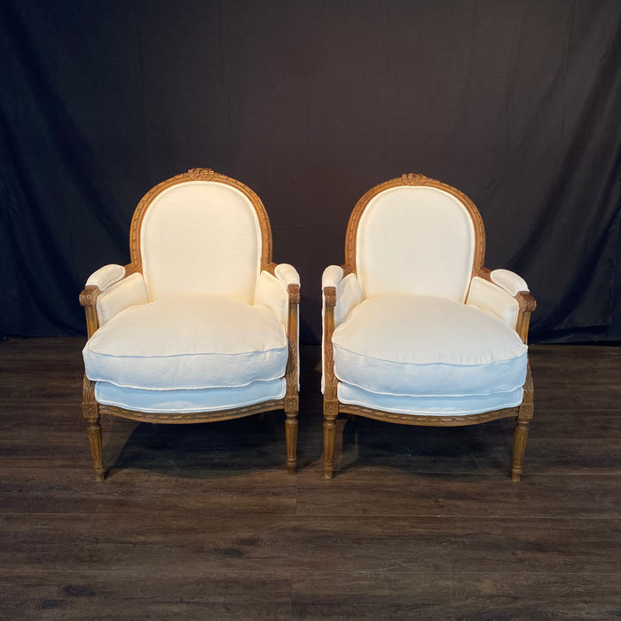 Pair of French Louis XVI Carved Walnut Armchairs or Bergere Chairs