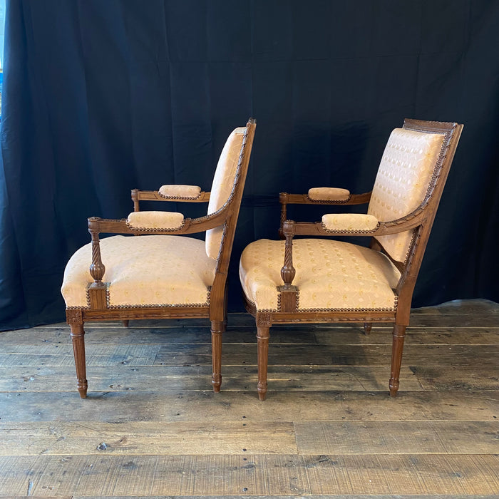 Pair of French Louis XVI Hand Carved Walnut Armchairs or Fauteuils Late 19th/Early 20th Century