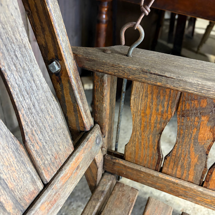 Antique Maine Wooden Porch Swing with Slatted Seat and Decorative Cutout Back