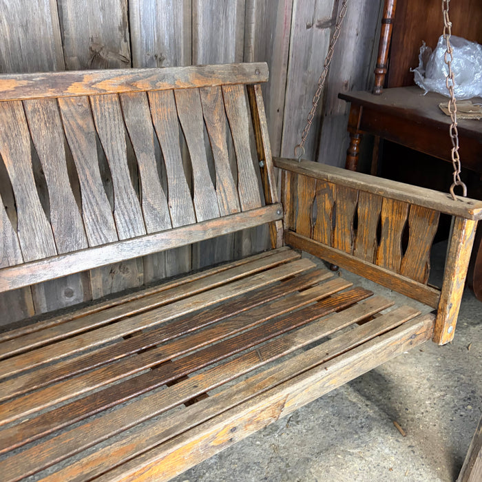 Antique Maine Wooden Porch Swing with Slatted Seat and Decorative Cutout Back