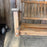 Antique Maine Wooden Porch Swing with Slatted Seat and Decorative Cutout Back