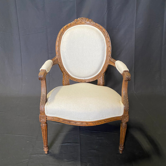 Classic French Pair of Antique Highly Carved Louis XVI Armchairs or Fauteuils Newly Reupholstered