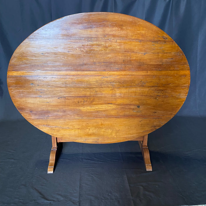 Large Oval French Early 19th Century Vigneron or Tilt-Top Walnut 'Table De Vendange' or Wine Tasting Table with Lovely Cherry Patina