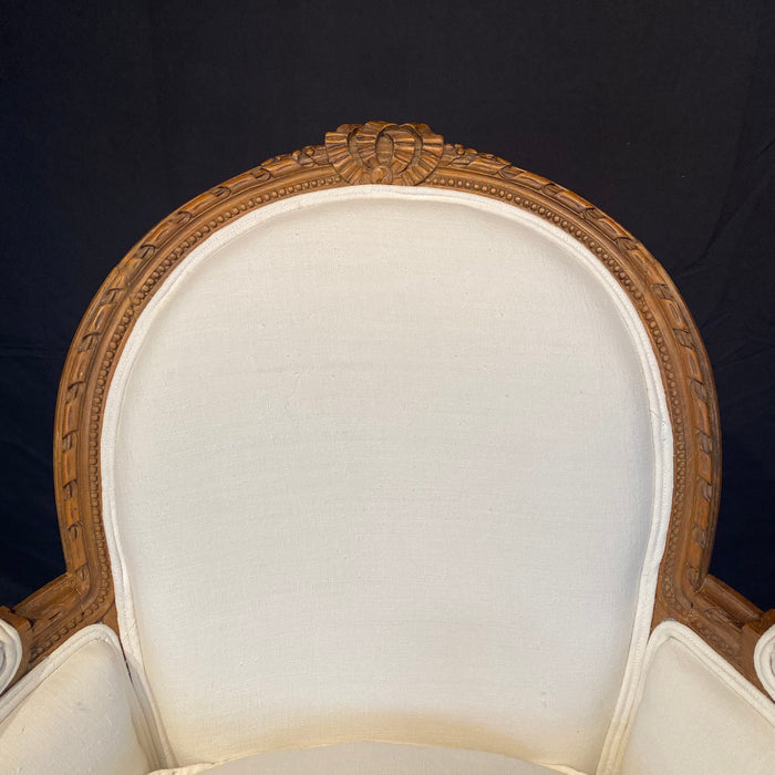 Pair of French Louis XVI Carved Walnut Armchairs or Bergere Chairs