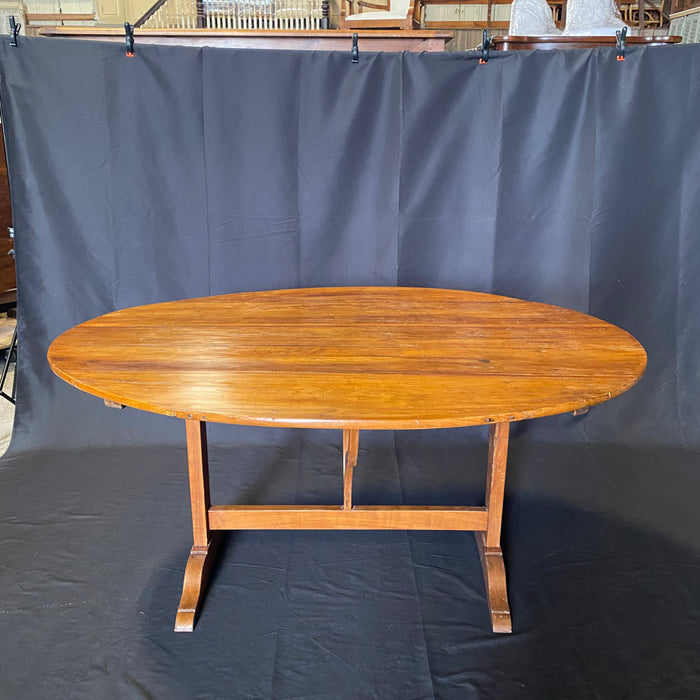 Large Oval French Early 19th Century Vigneron or Tilt-Top Walnut 'Table De Vendange' or Wine Tasting Table with Lovely Cherry Patina