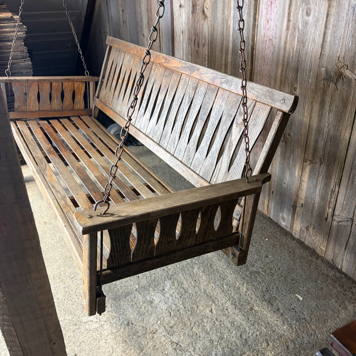 Antique Maine Wooden Porch Swing with Slatted Seat and Decorative Cutout Back