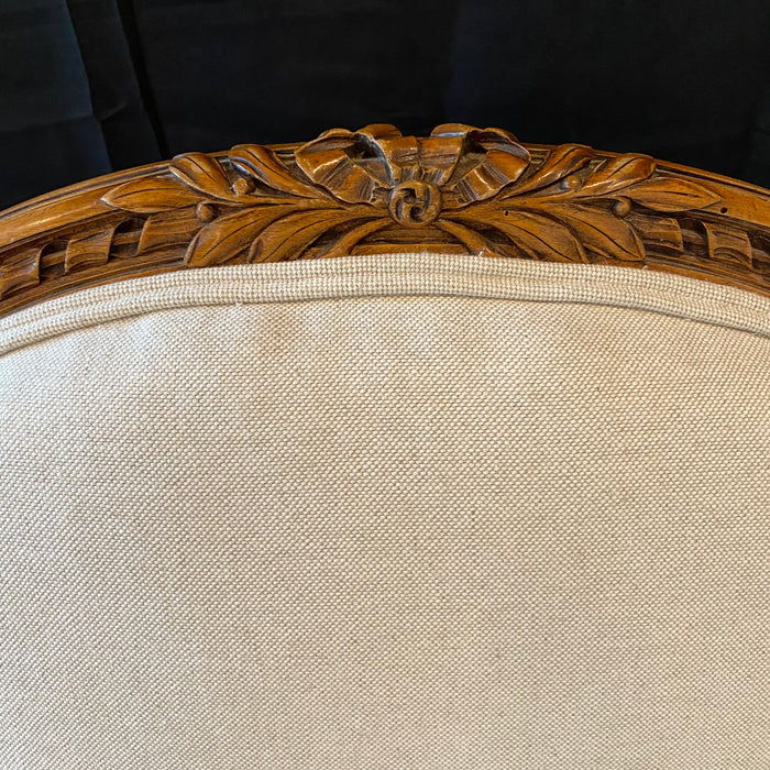 Pair of 19th Century French Louis XVI Carved Walnut Bergere Arm Chairs Newly Upholstered