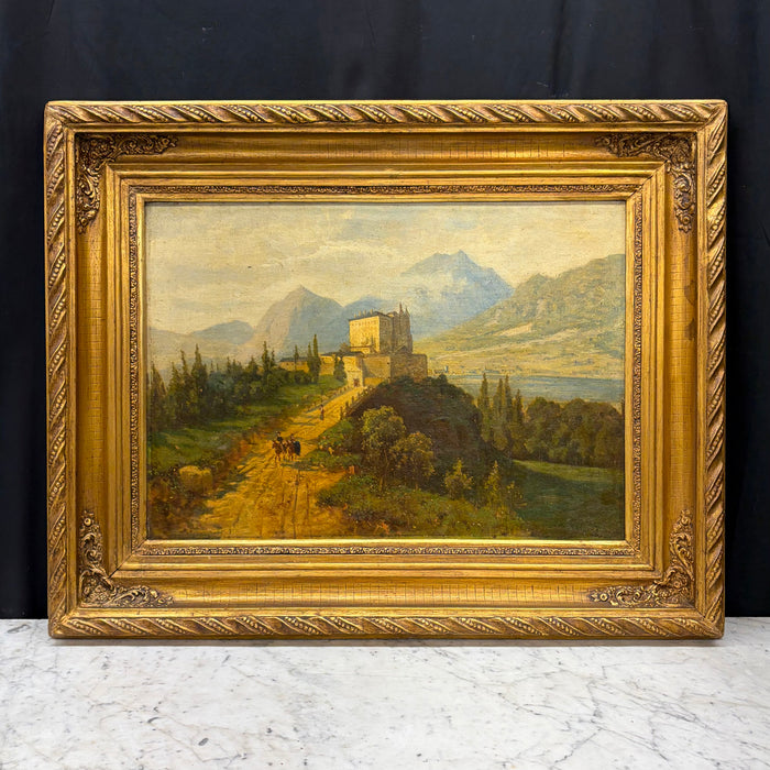 19th Century French Oil Painting of an Alpine Lake Landscape with Hilltop Castle and Horseback Riders in Ornate Gilt Frame