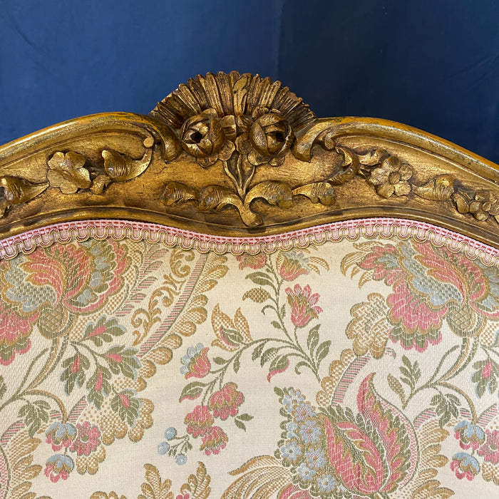 Pair of French Louis XV Giltwood Bergere Armchairs or Wingback Chairs with Carved Floral Motifs