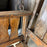 Antique Maine Wooden Porch Swing with Slatted Seat and Decorative Cutout Back