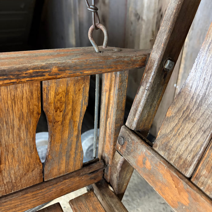 Antique Maine Wooden Porch Swing with Slatted Seat and Decorative Cutout Back