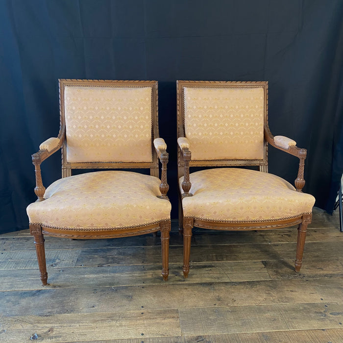 Pair of French Louis XVI Hand Carved Walnut Armchairs or Fauteuils Late 19th/Early 20th Century