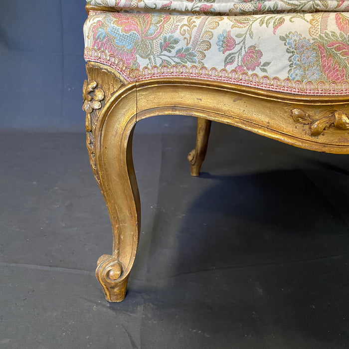 Pair of French Louis XV Giltwood Bergere Armchairs or Wingback Chairs with Carved Floral Motifs