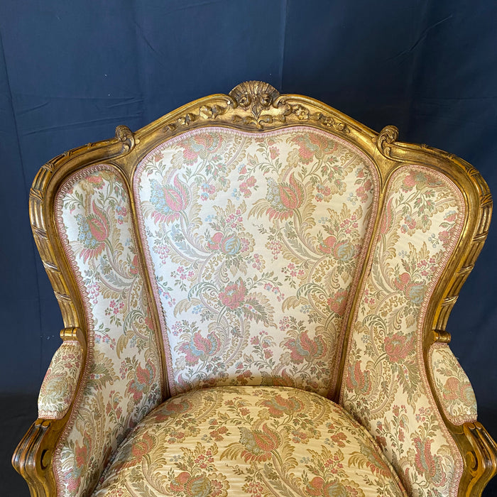 Pair of French Louis XV Giltwood Bergere Armchairs or Wingback Chairs with Carved Floral Motifs