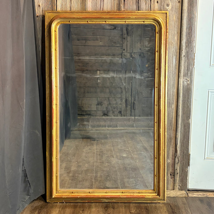 Exquisite 19th Century French Louis Philippe Large Giltwood Mirror with Rich Original Gold Leaf Gilding, Elegant Molded Frame and Beaded Detail