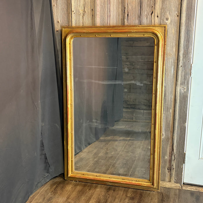 Exquisite 19th Century French Louis Philippe Large Giltwood Mirror with Rich Original Gold Leaf Gilding, Elegant Molded Frame and Beaded Detail