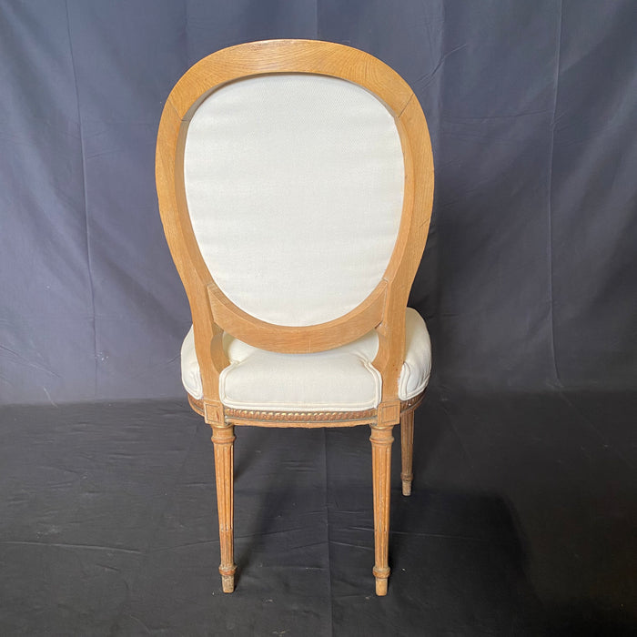 Set of Eight 19th Century French Louis XVI Dining Chairs with Original Giltwood and Hand Carving