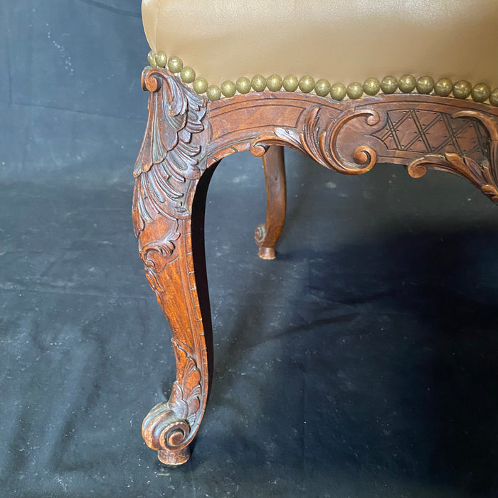 Fine French Leather Louis XV Carved Walnut Armchair with Carved Backrest Edges and Brass Tack Lining
