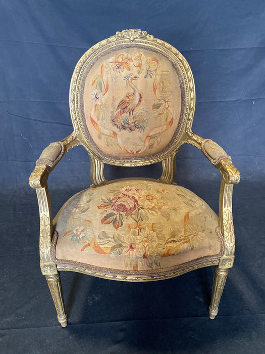 A Louis XIV style carved giltwood fauteuil