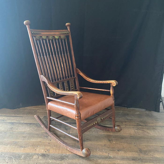 19th Century Leather and Brass Trimmed Soleil Rocking Chair with Pressed Brass Faces