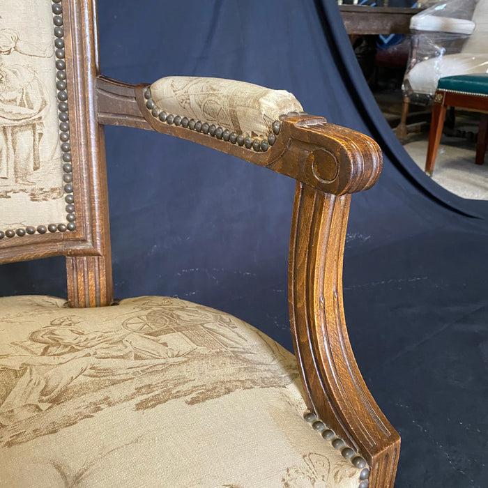 Pair of French Early 19th Century Walnut Louis XVI Armchairs or Fauteuils with Original Toile Upholstery and Brass Tacking