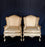 Antique pair of gold carved wingback style chairs 