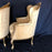 Antique pair of gold carved wingback style chairs 