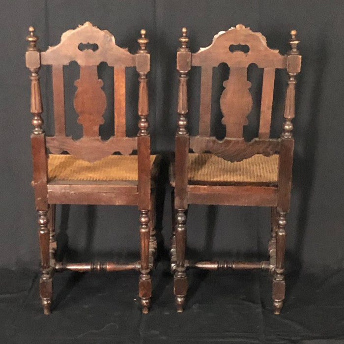 Pair of French Carved 19th Century Henri II Oak chairs with Caned Seats from Normandy