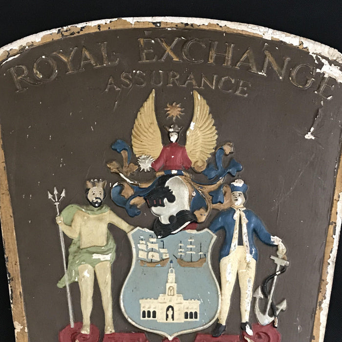 Antique insurance sign with a coat of arms crest design 