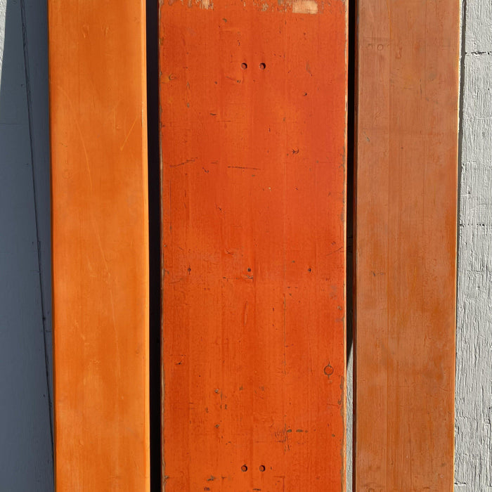 Picnic style orange painted wood folding table with two benches 