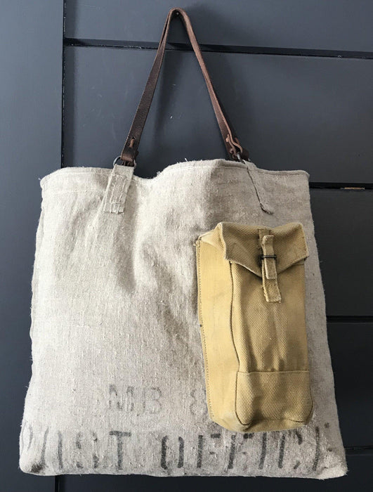 Vintage linen tote bag with an ammo pocket and leather handles